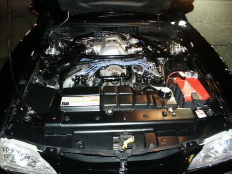 2001 Mercury Grand Marquis - The engine bay of a 2001 Ford Mustang GT, showing the V8 engine and associated components.