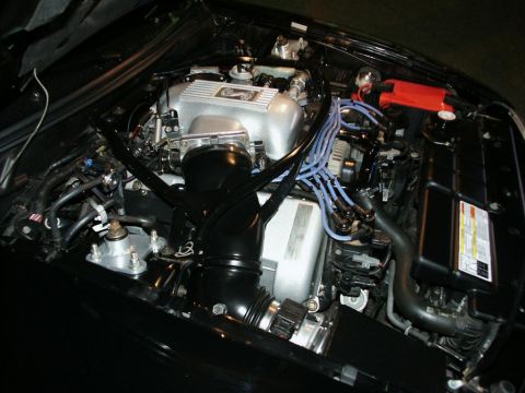 2001 Mercury Grand Marquis - Close-up view of a car's engine bay, showing various components and wiring.