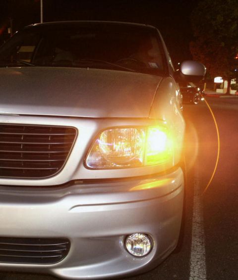 2001 Mercury Grand Marquis - Front view of a silver Ford F-150 truck at night.
