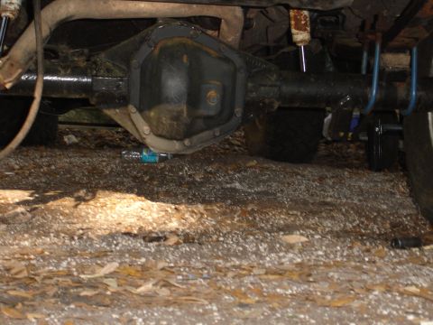 1989 Ford Bronco - Underside view of a Dana 70 rear axle assembly, likely from a modified vehicle.