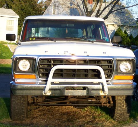 1979 Ford F-250 - This 1979 Ford F-250 is parked in a residential area with houses and trees in the background.