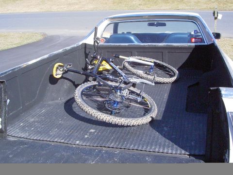 1972 Ford Ranchero - Pickup truck bed carrying two mountain bikes.