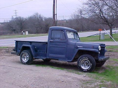 1978 Ford Bronco - This vintage Willys pickup truck is parked outdoors on a cloudy day.