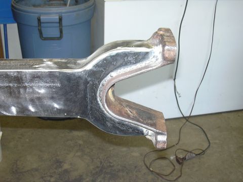 1991 Ford Bronco - Metal suspension part with a U-shaped bracket, likely for a vehicle's front end.