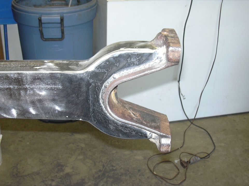 Close-up of a metal suspension component with a U-shaped bracket