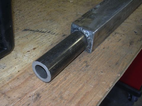 1991 Ford Bronco - Close-up view of a metal tube inserted into a square tube, showing a welded joint.