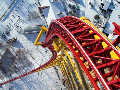1968 Ford Mustang - A snowy amusement park scene a roller coaster track from a high vantage point.