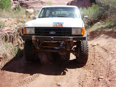 1987 Ford Bronco - it is hard to tell but my pass. side leaf is on a rock and my tire is up in the air