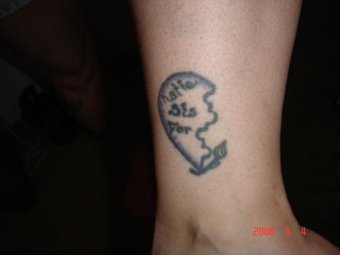 1990 Ford Bronco - A tattoo of a broken heart with text is visible on a person's leg.