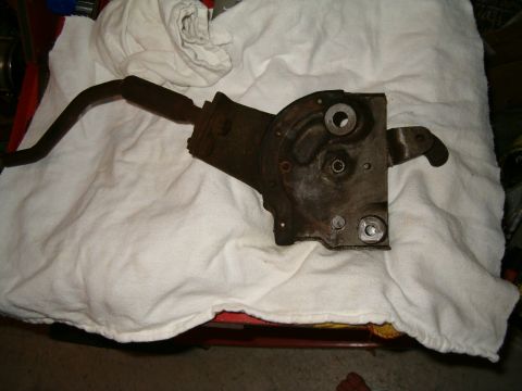 1979 Ford Bronco - A rusty parking brake assembly, likely from an older vehicle, is shown resting on a white cloth.