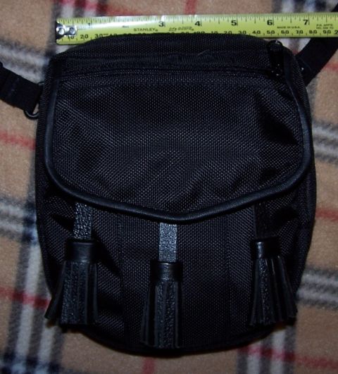 1990 Ford Bronco - Black sporran with tassels, measured with a tape measure.