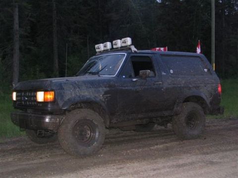 1989 Ford Bronco - This 1987 Ford Bronco is covered in mud, a light bar and a Canadian flag on the antenna.
