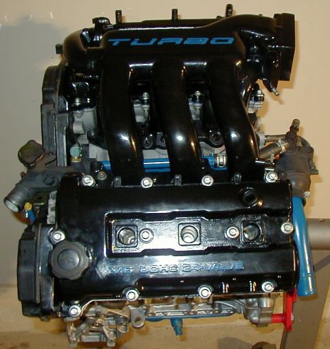 1995 Ford Probe - Engine with a black turbo intake manifold and V6 DOHC 24-valve engine cover.