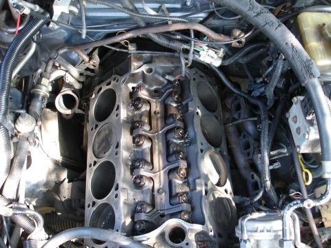 1989 Lincoln Continental - Close-up view of a disassembled engine block, revealing internal components.