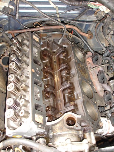 1989 Lincoln Continental - Close-up view of an engine's internal components, showing the cylinder head and valve train.
