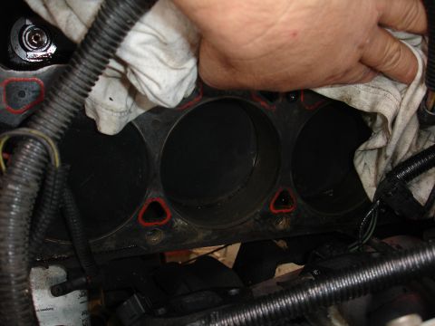 1989 Lincoln Continental - Close-up of engine cylinders and gasket during maintenance.