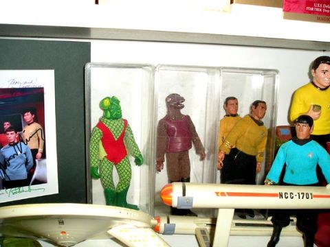 1984 Pontiac Fiero - A collection of Star Trek memorabilia, action figures and a model of the starship Enterprise.