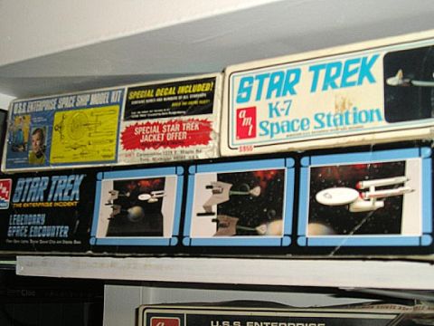 1984 Pontiac Fiero - Collection of Star Trek model kits, the U.S.S. Enterprise and K-7 Space Station, displayed on shelves.
