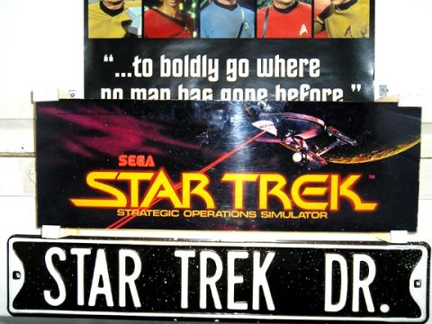 1984 Pontiac Fiero - Star Trek themed memorabilia including a license plate and a Sega arcade game sign.
