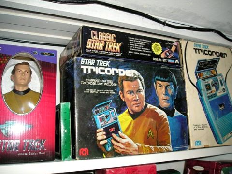 1984 Pontiac Fiero - Collection of Star Trek memorabilia including tricorder boxes and a Captain Kirk action figure.