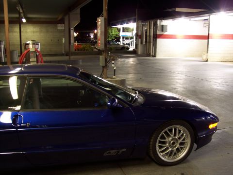1995 Ford Probe - A blue 1995 Ford Probe GT is parked at a car wash, showing off its aftermarket rims.