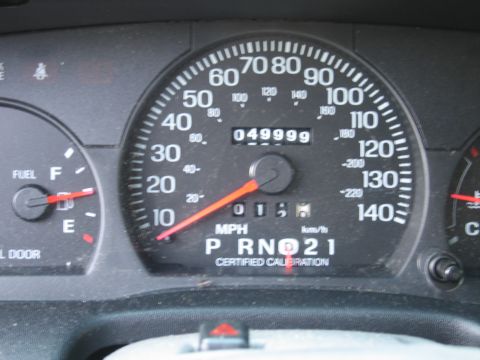 1991 Ford Crown Victoria LTD - The odometer reads 49,999 miles on this vehicle's dashboard.