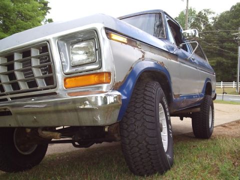 1978 Ford Bronco - This 1978 Ford Bronco shows significant rust and is equipped with large off-road tires.