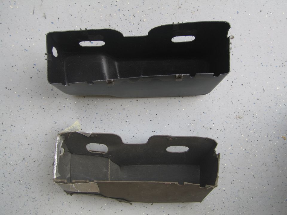 A new plastic glove box next to the old cardboard one.