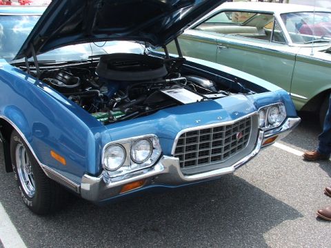 1972 Ford Ranchero - Front view of a blue 1972 Ford Ranchero with its hood up, revealing the engine bay.