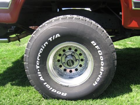 1984 Ford F-150 - Close-up of a BFGoodrich All-Terrain T/A tire and wheel assembly.