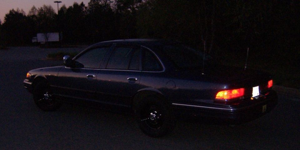 1996 Ford Crown Victoria parked at dusk, rear 3/4 view