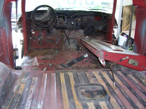 1978 Ford Bronco - Interior of a 1978 Ford Bronco undergoing restoration, with most components removed.