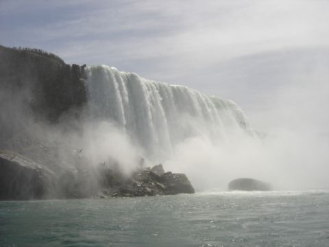 1999 Ford Taurus - A wide view of Niagara Falls on a hazy day, with water cascading over the cliff edge.