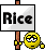 1996 Ford Crown Victoria - A sign with the word "Rice" and a smiley face icon is displayed on a wooden post.