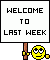 1996 Ford Crown Victoria - Sign with text 'WELCOME TO LAST WEEK' and a smiley face character on a green background.
