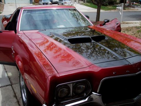 1972 Ford Ranchero - This 1972 Ford Ranchero has a prominent hood scoop and its doors are open.