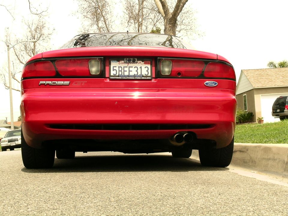 Rear view of a red 1993 Ford Probe GT with a California license plate