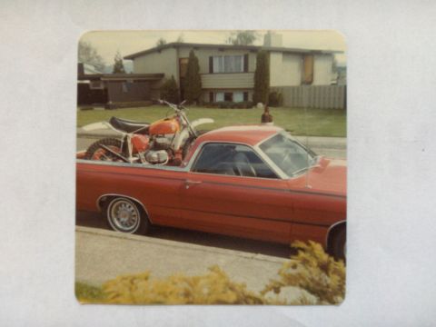 1968 Ford Ranchero - Red 1968 Ford Ranchero carrying an orange dirt bike in its bed.