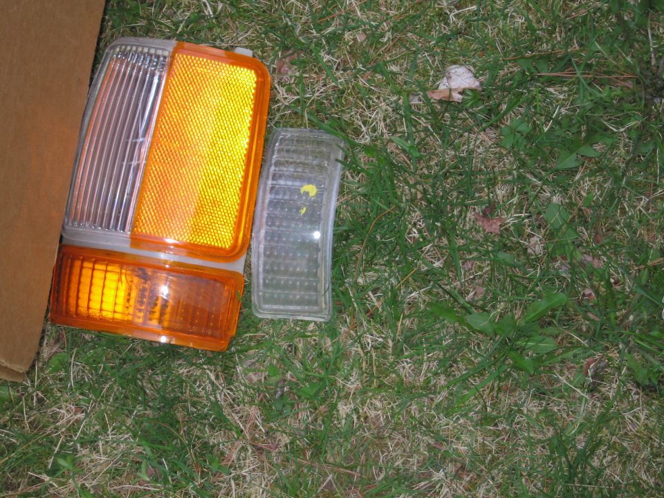 Car turn signal and marker lights on grass