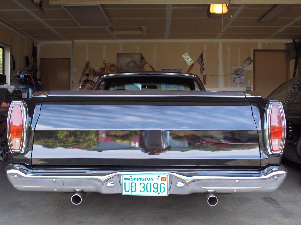 Rear view of a black 1968 Ford Ranchero with Washington license plate UB 3096
