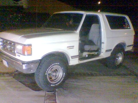 1988 Ford Bronco - The front grille and headlight design suggest this SUV is from the late 1980s, likely a 1987 model.
