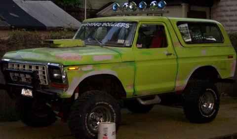1978 Ford Bronco - This 1978 Ford Bronco is ready for a new paint job, a prominent hood scoop and auxiliary lights on the roof.