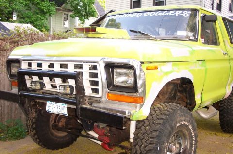 1978 Ford Bronco - This 1978 Ford Bronco features a prominent hood scoop and a heavy-duty bull bar on the front bumper.