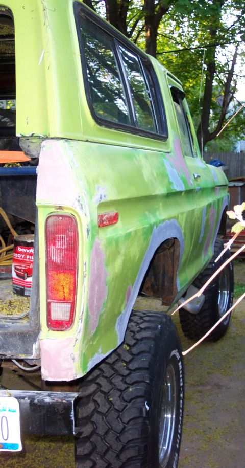 1978 Ford Bronco - This 1978 Ford Bronco is undergoing body work, with primer and filler visible on its rear quarter panel.