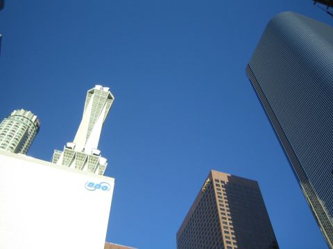 1968 Ford Mustang - A view of several tall buildings reaching into the bright blue sky on a clear day.