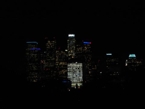 1968 Ford Mustang - A nighttime view of a city skyline with illuminated buildings.