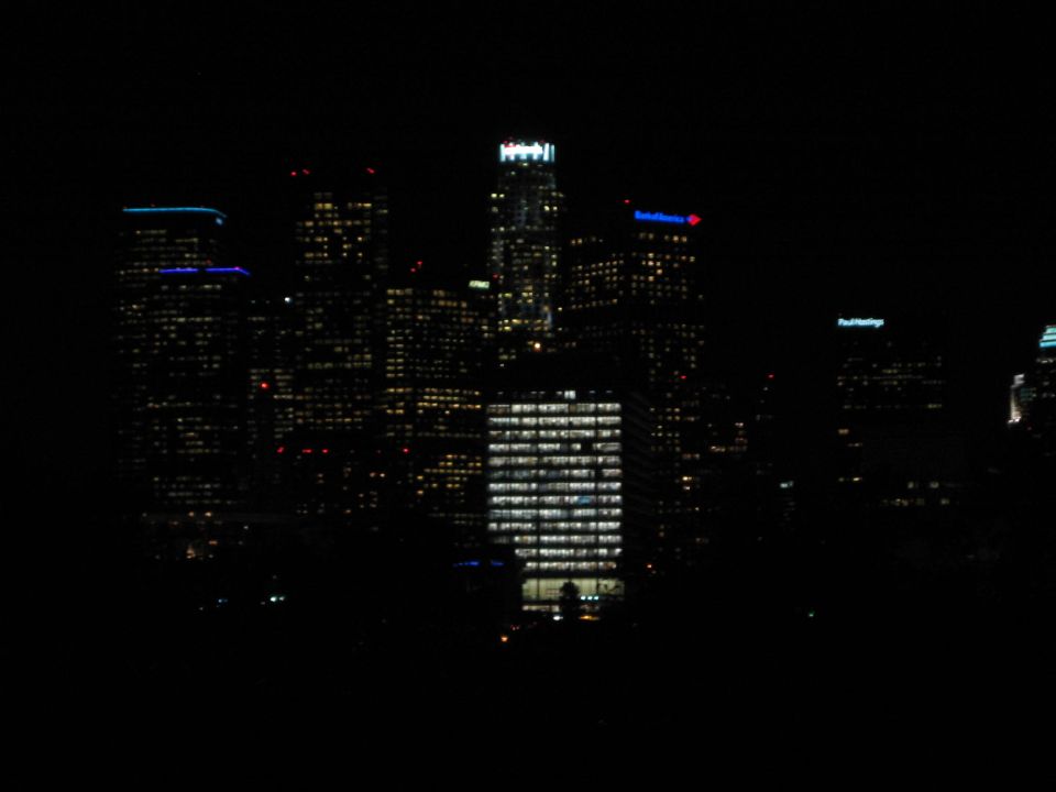 City skyline at night with illuminated buildings