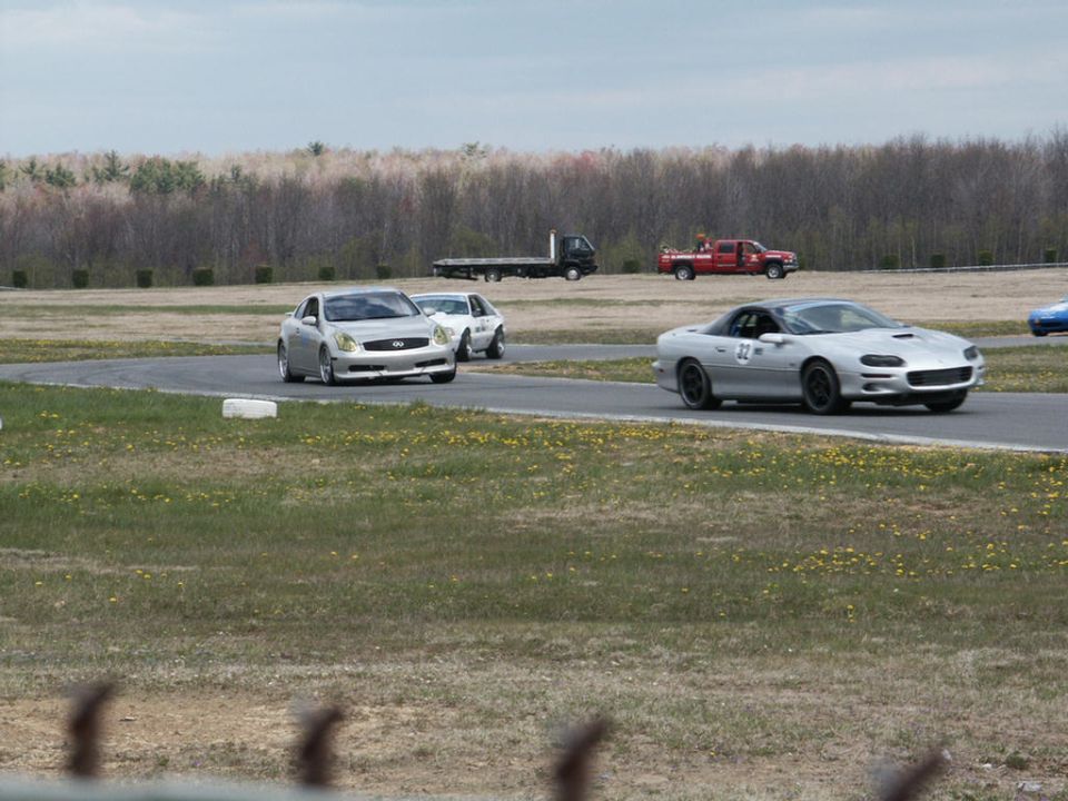 Silver Chevrolet Camaro with number 32 on door, 3q-front view