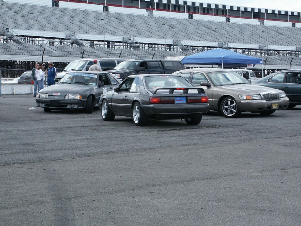 Gray 2001 Mercury Grand Marquis from rear, with spoiler and aftermarket wheels