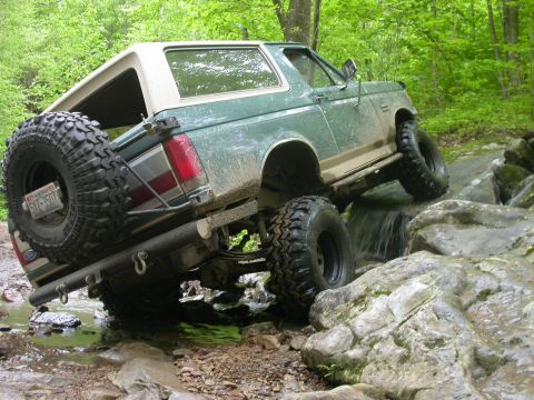 1990 Ford Bronco - This 1990 Ford Bronco is shown off-roading through a rocky stream.